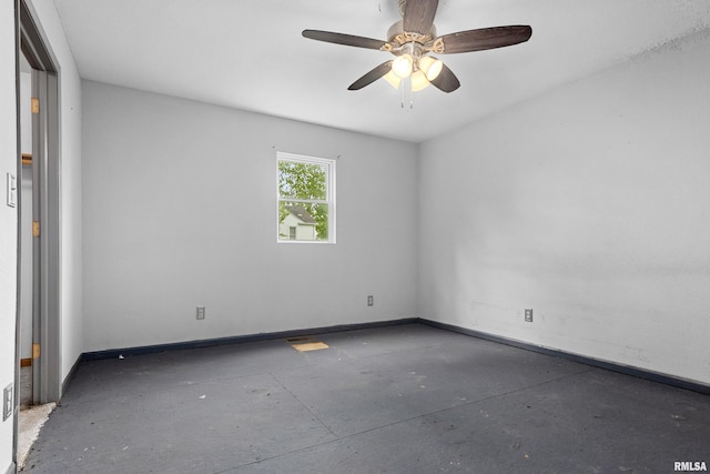 507 E Main St, Bryant, IL 61519 - unfurnished room with baseboards, ceiling fan, and concrete flooring