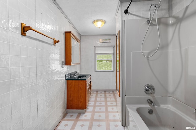 507 E Main St, Bryant, IL 61519 - bathroom with tile patterned floors, vanity, a textured ceiling, and bathtub / shower combination