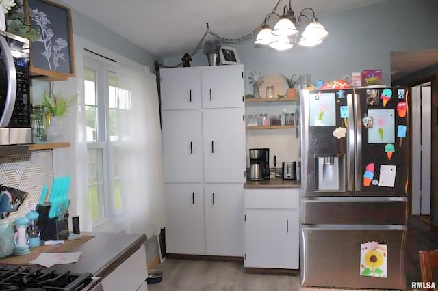 16338 E Red Maple Ln, Lewistown, IL 61542 - kitchen featuring stainless steel refrigerator with ice dispenser, open shelves, light wood-type flooring, a chandelier, and white cabinets