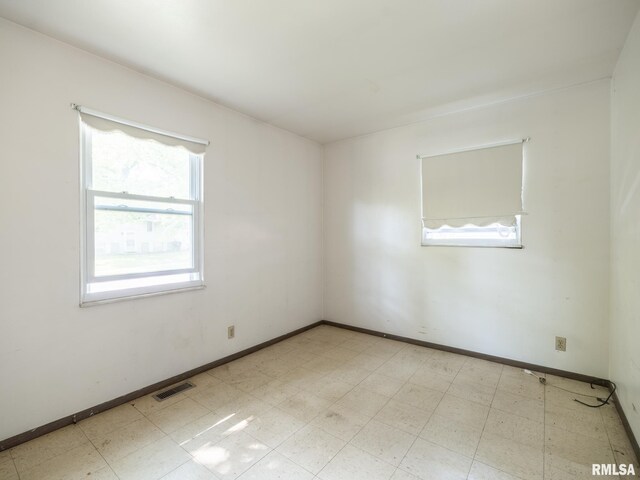 1908 N Idaho St, Peoria, IL 61604 - spare room with light flooring and baseboards