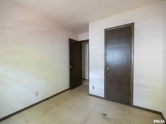 1908 N Idaho St, Peoria, IL 61604 - unfurnished bedroom featuring light floors and a closet