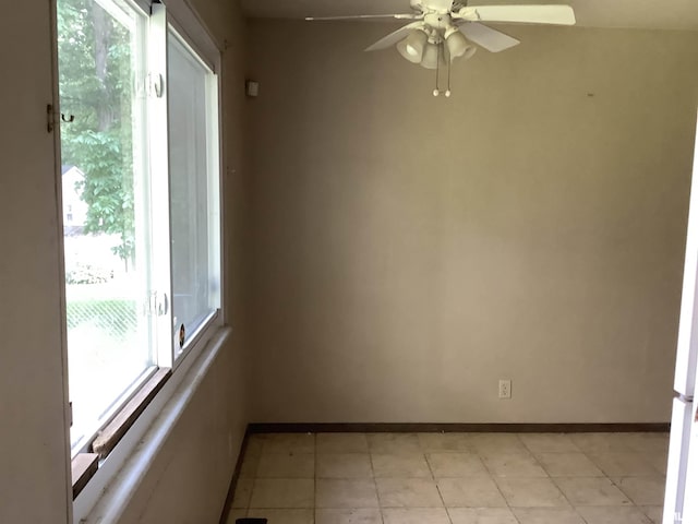 1908 N Idaho St, Peoria, IL 61604 - empty room with baseboards, a ceiling fan, and light tile patterned floors