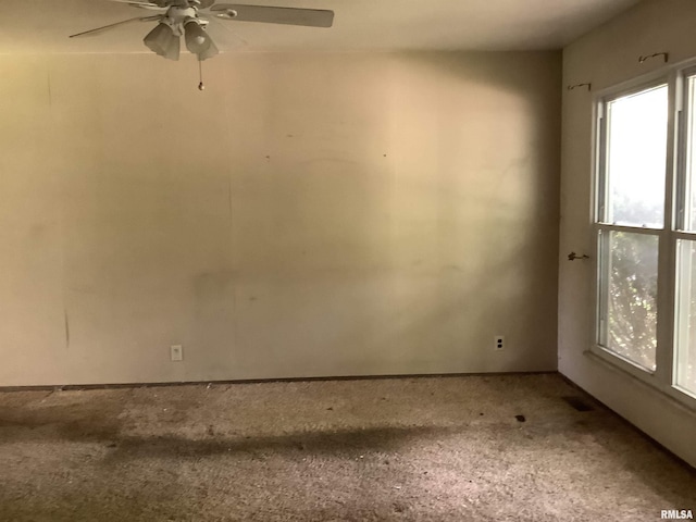 1908 N Idaho St, Peoria, IL 61604 - empty room with a ceiling fan and carpet floors