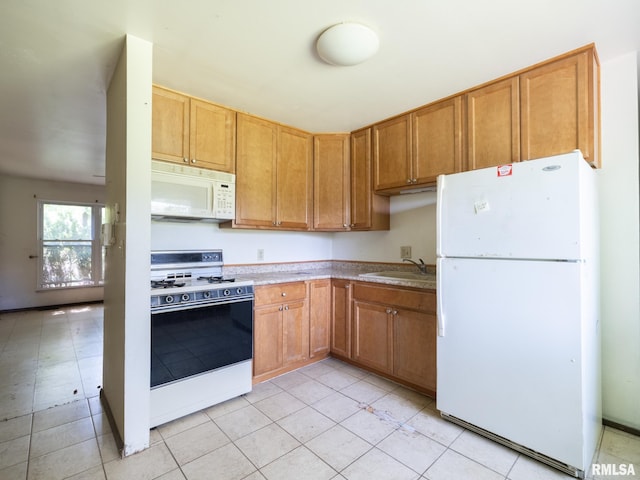 1908 N Idaho St, Peoria, IL 61604 - kitchen featuring white appliances, light countertops, and light tile patterned floors