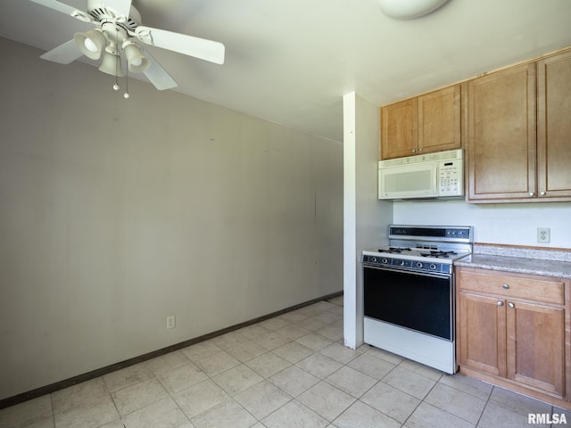 1908 N Idaho St, Peoria, IL 61604 - kitchen with white appliances, a ceiling fan, and light countertops