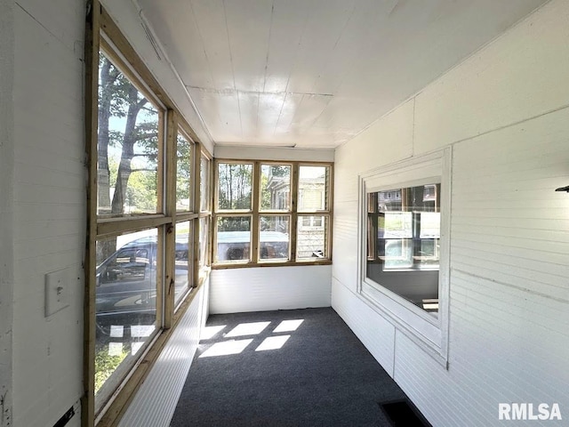 410 E Thrush Ave, Peoria, IL 61603 - unfurnished sunroom with carpet floors and healthy amount of natural light