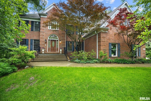 824 W Bridgetowne Ct, Dunlap, IL 61525 - colonial inspired home featuring a front yard and brick siding