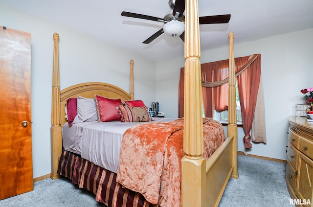 1202 W Purtscher Dr, Peoria, IL 61614 - carpeted bedroom with a ceiling fan and baseboards