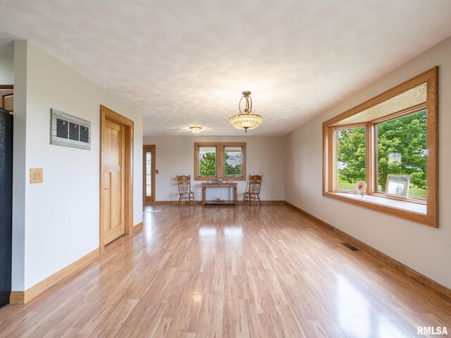 26620 Schuck Rd, Washington, IL 61571 - empty room with light wood-style floors and baseboards