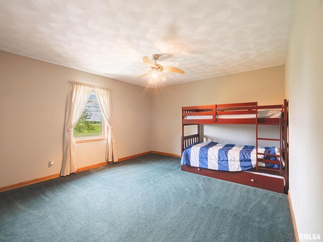 26620 Schuck Rd, Washington, IL 61571 - unfurnished bedroom featuring carpet flooring, baseboards, and a ceiling fan