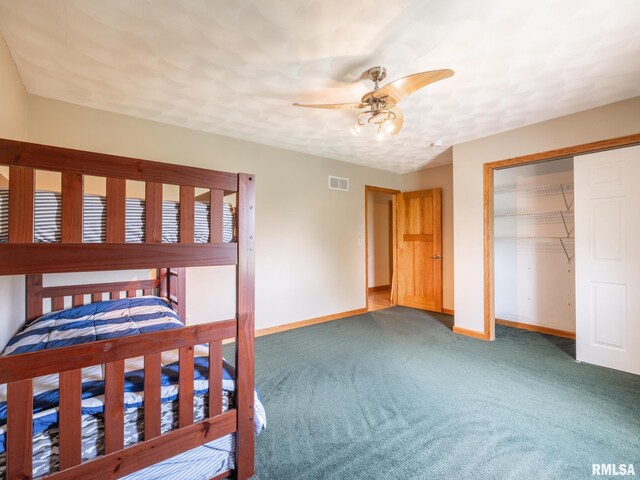 26620 Schuck Rd, Washington, IL 61571 - unfurnished bedroom with baseboards, carpet floors, a closet, and ceiling fan