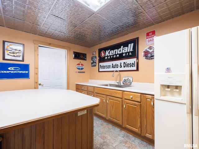 26620 Schuck Rd, Washington, IL 61571 - kitchen with white refrigerator with ice dispenser, an ornate ceiling, a sink, light countertops, and brown cabinetry