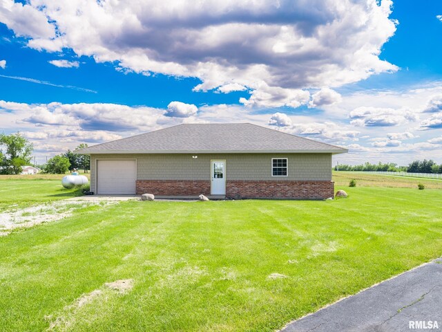 26620 Schuck Rd, Washington, IL 61571 - view of side of property featuring a lawn, brick siding, and driveway