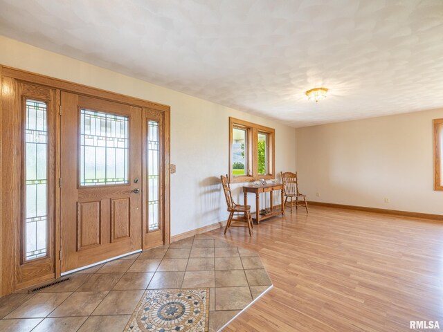 26620 Schuck Rd, Washington, IL 61571 - foyer with baseboards and light wood-style floors