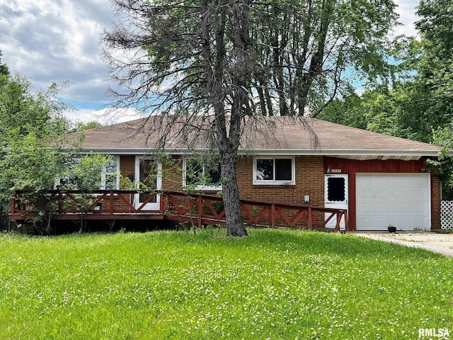 9333 S Powell Rd, Peoria, IL 61607 - ranch-style home featuring a garage, brick siding, a front lawn, and a wooden deck