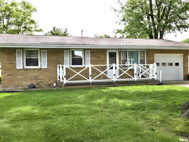 407 N 12th Ave, Canton, IL 61520 - ranch-style house with a porch, a garage, a front yard, and brick siding