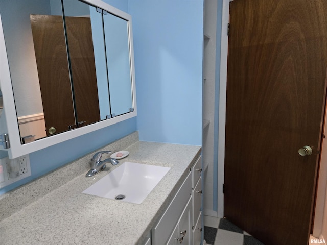 407 N 12th Ave, Canton, IL 61520 - bathroom featuring vanity and tile patterned floors