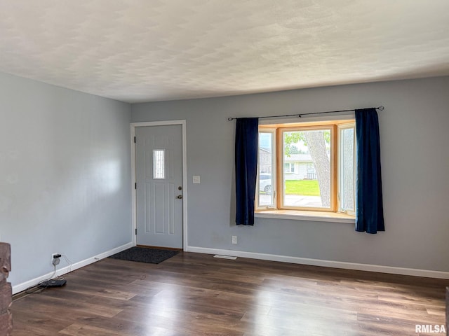 311 N 5th St, Chillicothe, IL 61523 - entrance foyer with baseboards and dark wood-type flooring