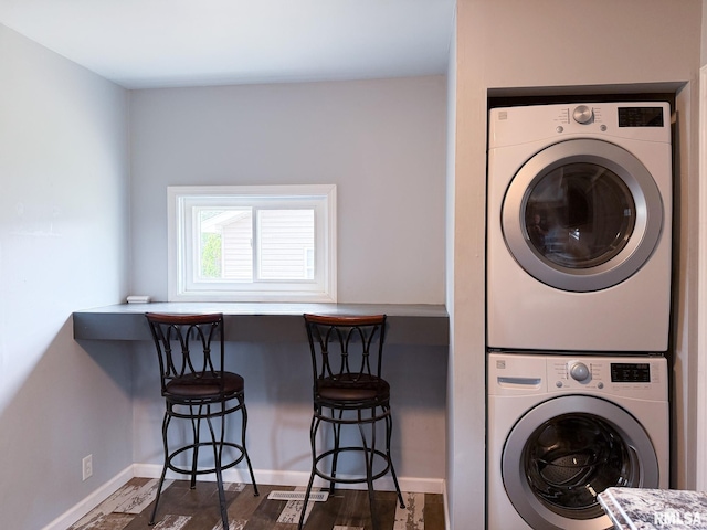311 N 5th St, Chillicothe, IL 61523 - laundry room featuring stacked washer / drying machine, baseboards, and dark wood-type flooring