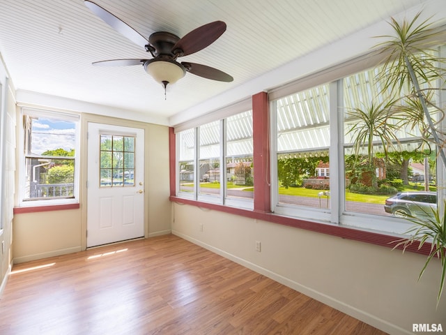 110 Loren St, Washington, IL 61571 - unfurnished sunroom with baseboards and wood finished floors