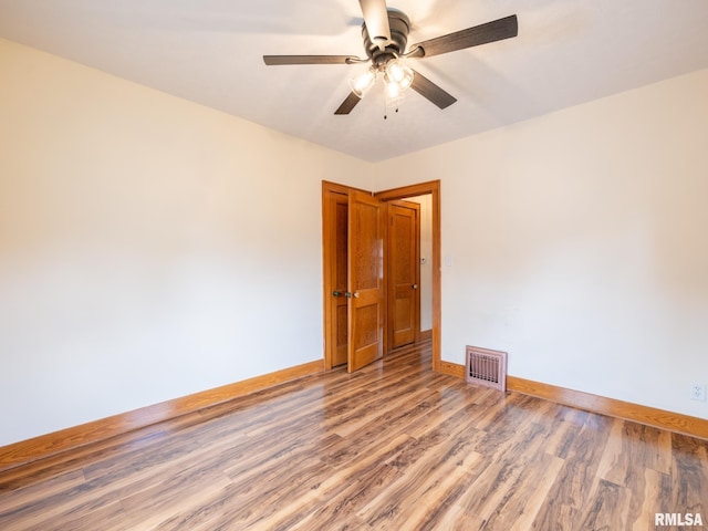 110 Loren St, Washington, IL 61571 - unfurnished room with baseboards, wood finished floors, and ceiling fan