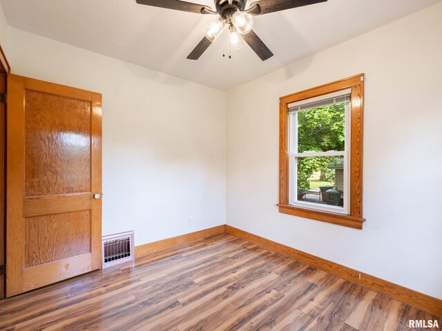 110 Loren St, Washington, IL 61571 - spare room with wood finished floors, baseboards, and a ceiling fan