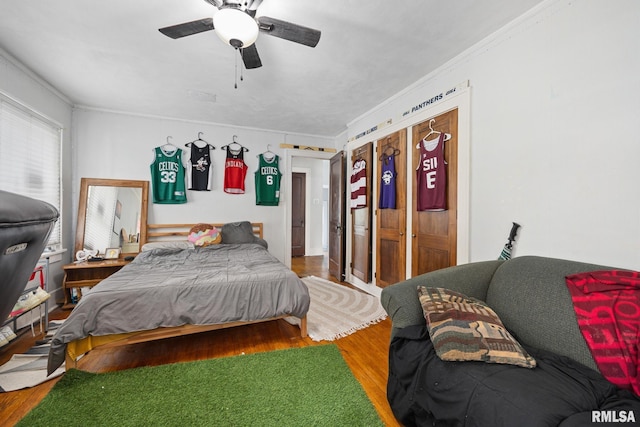 1006 N Maplewood Ave, Peoria, IL 61606 - bedroom with wood finished floors, ornamental molding, and ceiling fan