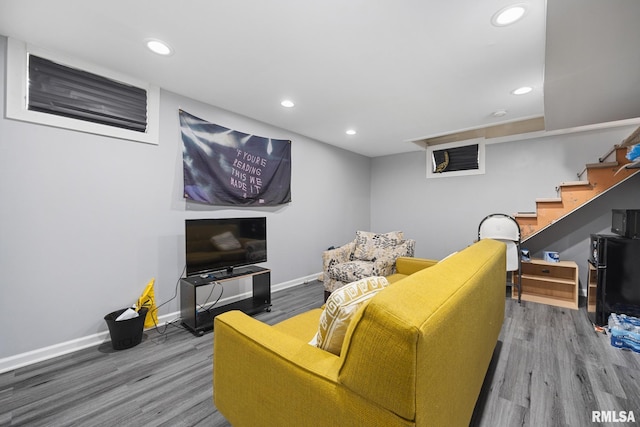 1006 N Maplewood Ave, Peoria, IL 61606 - living area with wood finished floors, baseboards, recessed lighting, and stairway