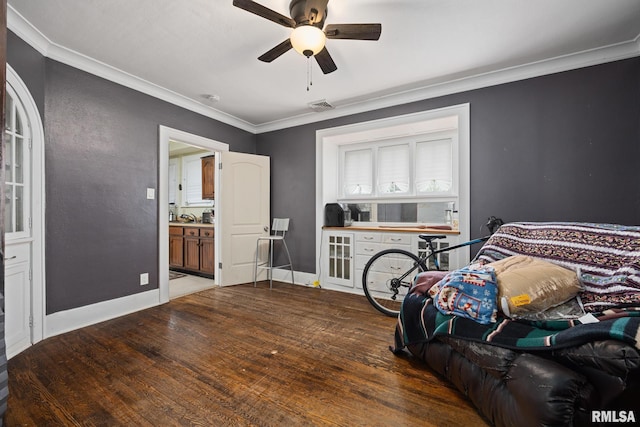 1006 N Maplewood Ave, Peoria, IL 61606 - bedroom with wood finished floors, crown molding, ensuite bath, baseboards, and a ceiling fan