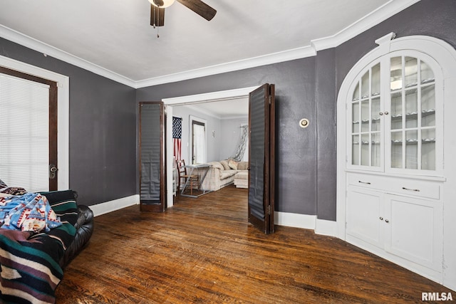 1006 N Maplewood Ave, Peoria, IL 61606 - living area with wood finished floors, baseboards, ornamental molding, and ceiling fan