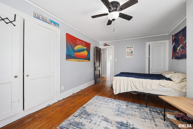 1006 N Maplewood Ave, Peoria, IL 61606 - bedroom with wood finished floors, baseboards, ornamental molding, and a ceiling fan