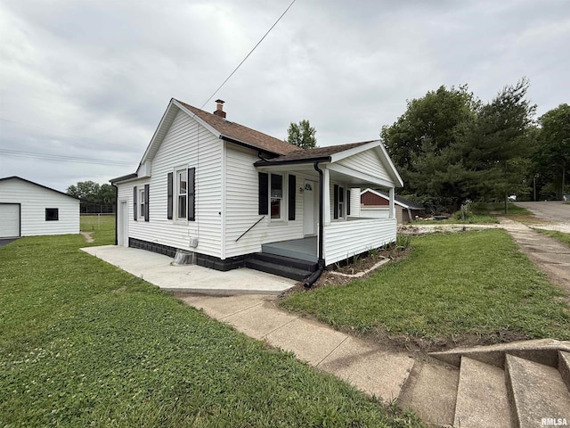 210 Minch St, South Pekin, IL 61564 - view of property exterior featuring covered porch, a lawn, a chimney, and roof with shingles