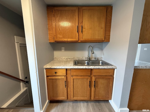 210 Minch St, South Pekin, IL 61564 - bar with a sink, light wood-style floors, and baseboards