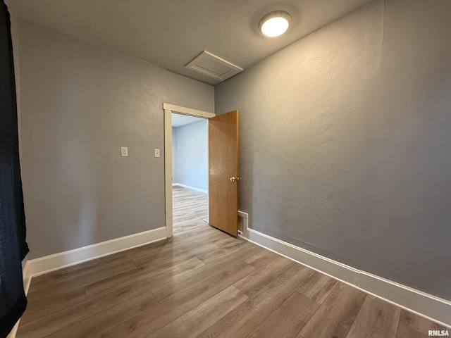 210 Minch St, South Pekin, IL 61564 - spare room with attic access, wood finished floors, and baseboards
