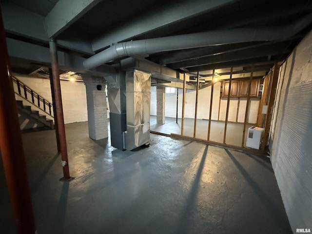 210 Minch St, South Pekin, IL 61564 - unfinished below grade area with stairs and heating unit