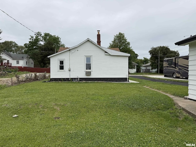 210 Minch St, South Pekin, IL 61564 - view of side of home featuring a yard and a chimney
