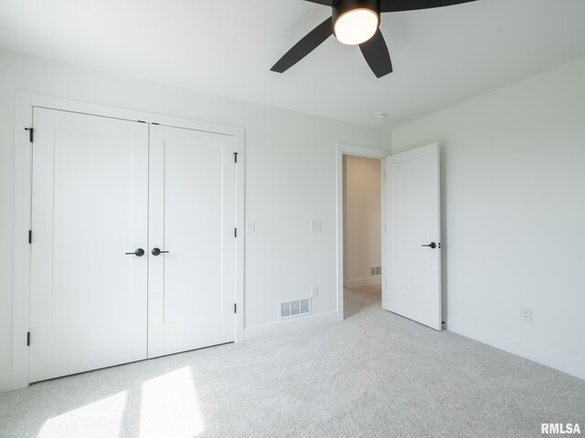 112 Shannon Hills Dr, Washington, IL 61571 - unfurnished bedroom featuring carpet flooring, a closet, baseboards, and ceiling fan