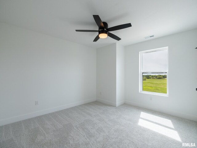 112 Shannon Hills Dr, Washington, IL 61571 - empty room featuring light colored carpet, ceiling fan, and baseboards