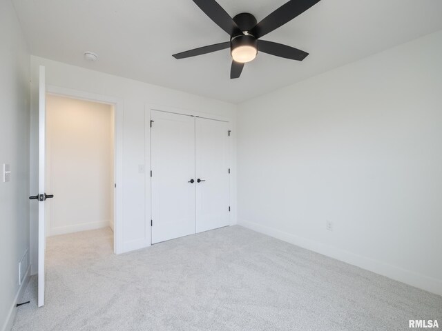 112 Shannon Hills Dr, Washington, IL 61571 - unfurnished bedroom featuring carpet, baseboards, a closet, and a ceiling fan