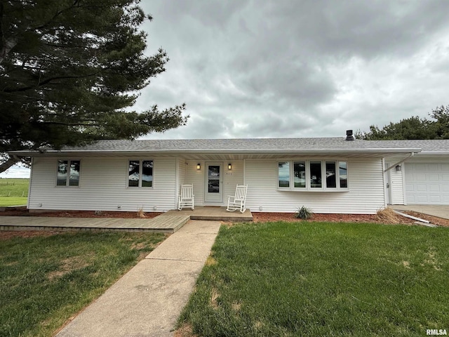 4170 E 1200th St, Macomb, IL 61455 - single story home featuring a garage, a porch, a front yard, and a shingled roof