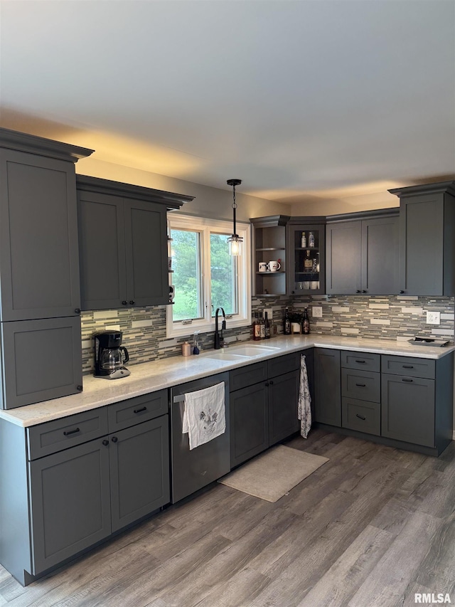 4170 E 1200th St, Macomb, IL 61455 - kitchen with dishwasher, tasteful backsplash, light wood-type flooring, and a sink