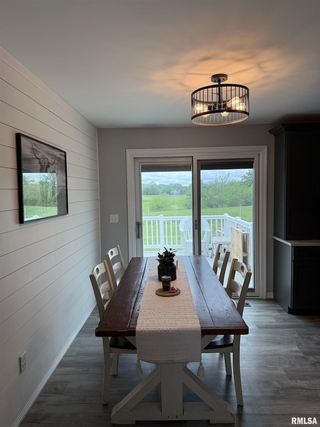 4170 E 1200th St, Macomb, IL 61455 - dining area featuring wooden walls, baseboards, and wood finished floors