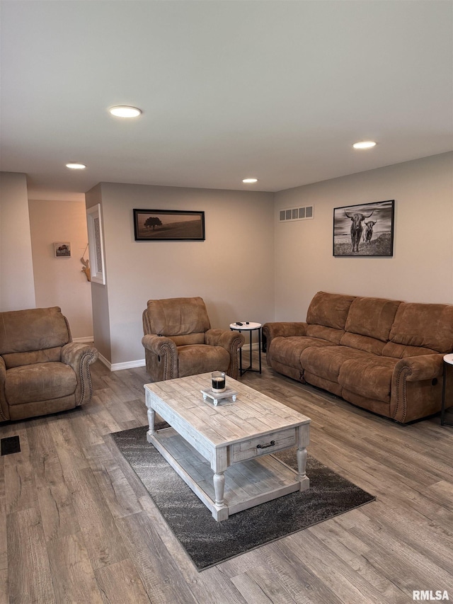 4170 E 1200th St, Macomb, IL 61455 - living room featuring wood finished floors, recessed lighting, and baseboards