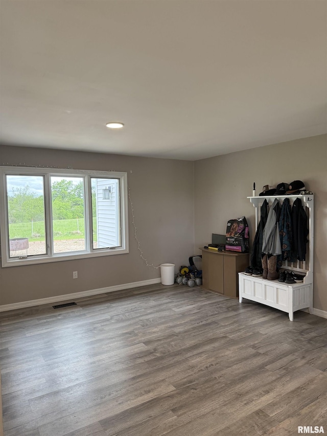 4170 E 1200th St, Macomb, IL 61455 - unfurnished living room featuring baseboards, wood finished floors, and recessed lighting
