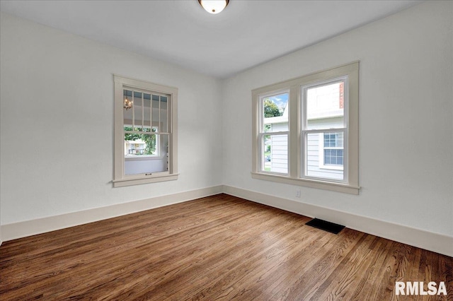 2623 W Ardmore Pl, West Peoria, IL 61604 - spare room featuring wood finished floors and baseboards
