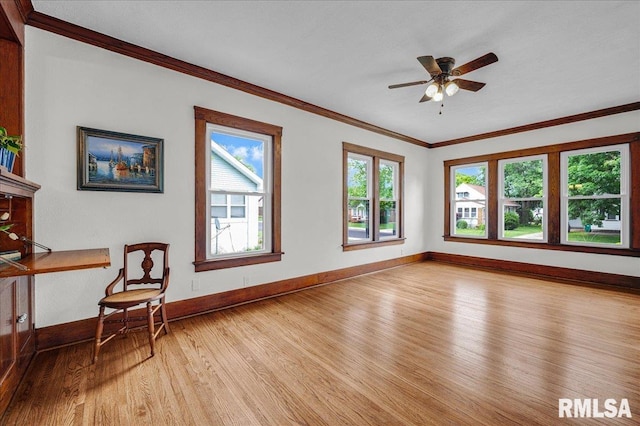 2623 W Ardmore Pl, West Peoria, IL 61604 - unfurnished room with light wood finished floors, crown molding, baseboards, and ceiling fan