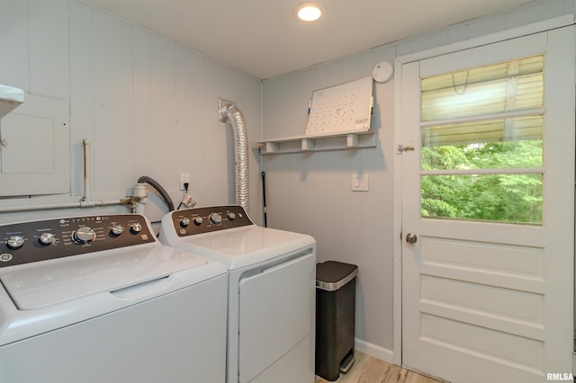 153 Hollywood Cir, Creve Coeur, IL 61610 - washroom with washing machine and clothes dryer, electric panel, and light wood-style flooring
