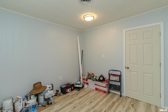 153 Hollywood Cir, Creve Coeur, IL 61610 - spare room featuring light wood-style flooring and crown molding