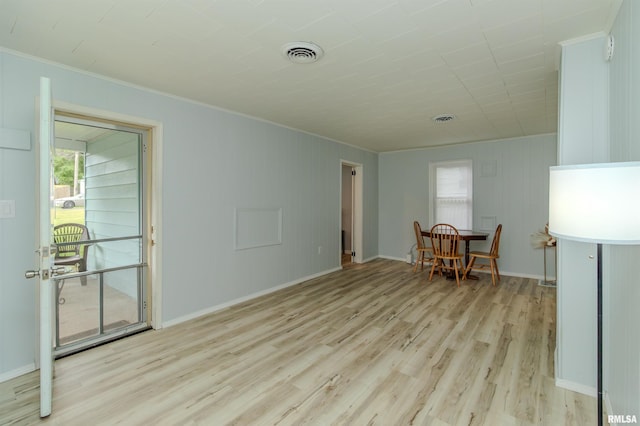 153 Hollywood Cir, Creve Coeur, IL 61610 - empty room with light wood-style flooring, healthy amount of natural light, baseboards, and crown molding