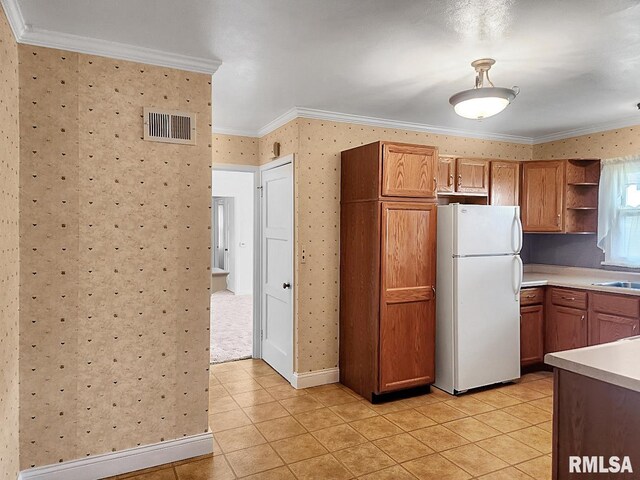 419 S Franklin St, Toulon, IL 61483 - kitchen with freestanding refrigerator, open shelves, ornamental molding, light tile patterned flooring, and light countertops